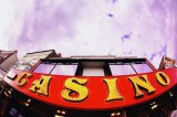 CASINO sign: amusement bright building chance colour colourful color colorful electricity enjoyment entertainment exciting fun neon gamble blue sky UK seaside resort holiday vacation leisure relax