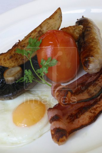 Full English Breakfast.  With fried egg, mushrooms, bacon, tomato and sausage.